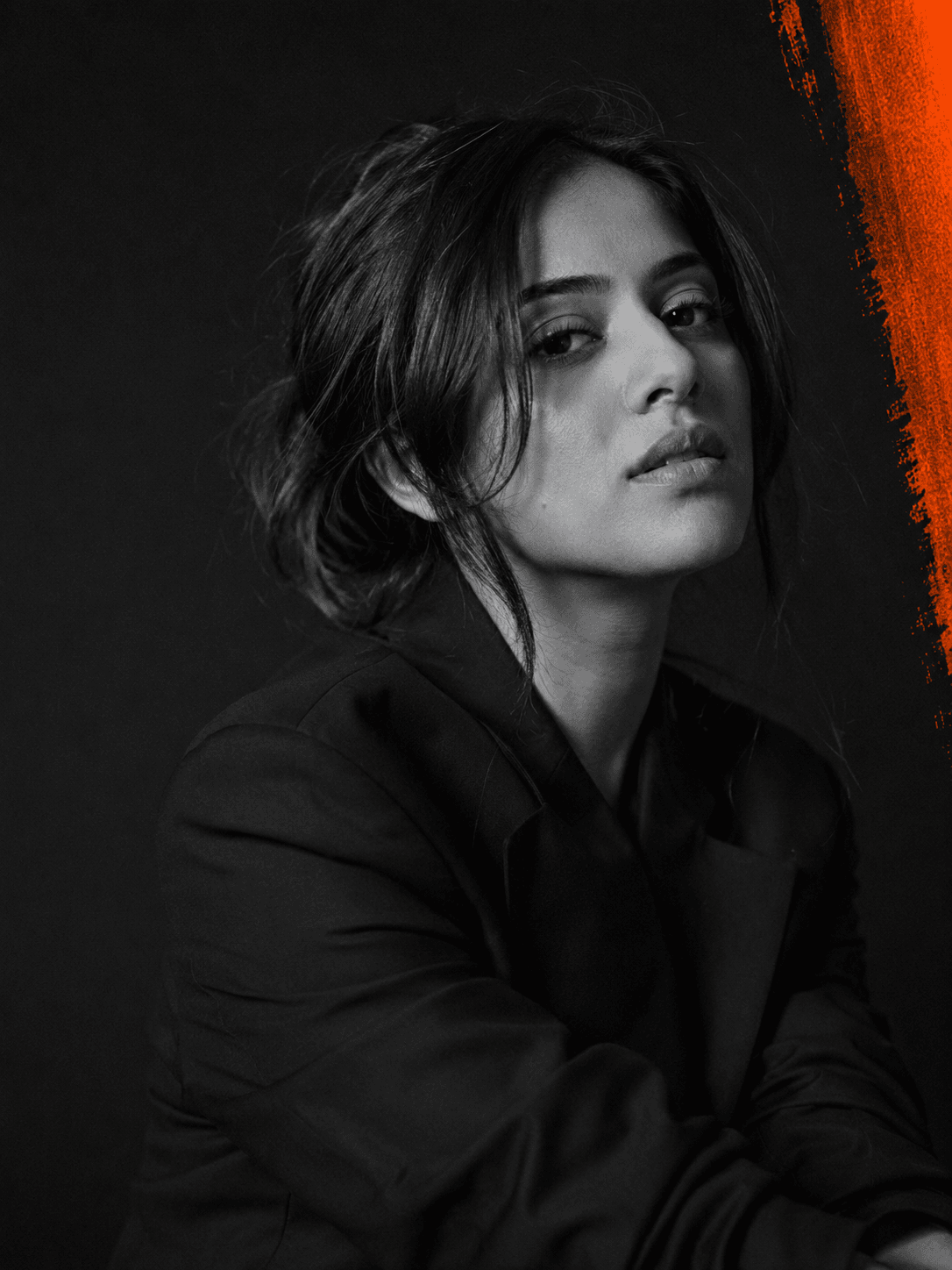 Editorial black-and-white portrait with an orange accent, part of Flare Studio's visual identity